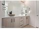 Bathroom featuring double stone vessel sinks, a large mirror, and modern fixtures and hardware at 3942 N San Marin Dr, Florence, AZ 85132