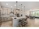 Modern kitchen featuring a large island, stainless steel appliances, and stylish pendant lighting at 3942 N San Marin Dr, Florence, AZ 85132