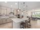 Modern kitchen featuring a large island, stainless steel appliances, and stylish pendant lighting at 3942 N San Marin Dr, Florence, AZ 85132