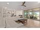 Open-concept living room showcasing a large sectional sofa, and seamless transition to other spaces at 3942 N San Marin Dr, Florence, AZ 85132