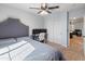 Neutral bedroom with gray accents, double closet, and ceiling fan at 39526 N White Tail Ln, Anthem, AZ 85086