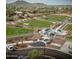 Aerial view of a well-maintained dog park with walking paths and separate areas for large and small dogs at 39526 N White Tail Ln, Anthem, AZ 85086