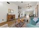 Open concept living room featuring wood floors and an open staircase at 39526 N White Tail Ln, Anthem, AZ 85086