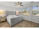 Main bedroom with ample natural light and a large upholstered bed at 39526 N White Tail Ln, Anthem, AZ 85086