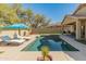 Backyard pool with lounge chairs and manicured landscaping at 39526 N White Tail Ln, Anthem, AZ 85086