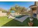 Sparkling pool with lounge chairs and a covered patio at 39526 N White Tail Ln, Anthem, AZ 85086