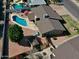 Aerial view of home with pool, patio area, storage shed, and well-maintained yard at 4201 W Brown St, Phoenix, AZ 85051