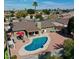 A backyard featuring a covered patio, pool, and low maintenance landscaping at 4201 W Brown St, Phoenix, AZ 85051