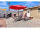 Paver patio area with seating and barbecue grill in a backyard featuring desert landscaping at 4201 W Brown St, Phoenix, AZ 85051