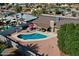 Aerial view showcases a pristine pool and patio area perfect for outdoor entertainment at 4201 W Brown St, Phoenix, AZ 85051