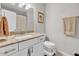 A vanity with granite countertops, white cabinets, and a modern faucet in this bathroom at 4201 W Brown St, Phoenix, AZ 85051