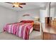 Bedroom with comfortable bed, wood dresser, and neutral colored walls at 4201 W Brown St, Phoenix, AZ 85051