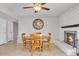 Cozy dining area features a brick fireplace and a wooden table set for intimate gatherings at 4201 W Brown St, Phoenix, AZ 85051