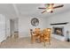 Cozy dining area features a brick fireplace and a wooden table set for intimate gatherings at 4201 W Brown St, Phoenix, AZ 85051