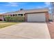 Inviting single-story home with a well-maintained front yard and spacious two-car garage at 4201 W Brown St, Phoenix, AZ 85051