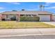 Charming single-story home with well-manicured front yard and attached two car garage at 4201 W Brown St, Phoenix, AZ 85051