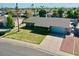 Charming single-story home with well-manicured lawn, mature trees, and a spacious driveway at 4201 W Brown St, Phoenix, AZ 85051