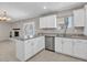 Bright kitchen featuring an island, stainless steel appliances, and views of the Gathering room at 4201 W Brown St, Phoenix, AZ 85051