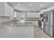 A complete kitchen view with granite countertops, white cabinets, and stainless steel appliances at 4201 W Brown St, Phoenix, AZ 85051