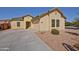 Charming home featuring a two-car garage and a well-maintained front yard at 45322 W Sandhill Rd, Maricopa, AZ 85139