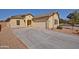 Charming home featuring a two-car garage and a well-maintained front yard at 45322 W Sandhill Rd, Maricopa, AZ 85139