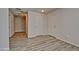 Hallway with multiple doors and wood-style flooring at 45322 W Sandhill Rd, Maricopa, AZ 85139