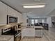 Kitchen featuring stainless steel appliances and an open view into the living room at 45322 W Sandhill Rd, Maricopa, AZ 85139