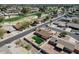 A scenic aerial view highlights the home's backyard, adjacent to lush greenery at 4826 E Navajo Cir, Phoenix, AZ 85044