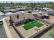 A scenic aerial view showcases a backyard with artificial turf, patio and privacy fence at 4826 E Navajo Cir, Phoenix, AZ 85044