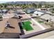 Aerial view of a backyard featuring a pristine lawn, mature trees, and privacy fence at 4826 E Navajo Cir, Phoenix, AZ 85044