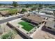 A scenic aerial view showcases a backyard with artificial turf, patio and privacy fence at 4826 E Navajo Cir, Phoenix, AZ 85044