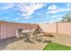 Charming patio featuring a comfortable seating area amidst low-maintenance desert landscaping at 4826 E Navajo Cir, Phoenix, AZ 85044