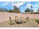 Relaxing backyard patio with desert landscaping and outdoor seating, perfect for enjoying the desert climate at 4826 E Navajo Cir, Phoenix, AZ 85044