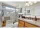 Elegant bathroom with a marble shower, modern fixtures, and ample lighting at 4826 E Navajo Cir, Phoenix, AZ 85044