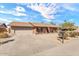 Inviting home featuring a two-car garage, brick accents, and low-maintenance desert landscaping at 4826 E Navajo Cir, Phoenix, AZ 85044