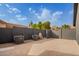 Spacious backyard area with HVAC units, surrounded by fencing for privacy and security at 5726 E Woodridge Dr, Scottsdale, AZ 85254