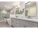 Bright bathroom featuring double vanity, quartz countertops and a walk-in shower at 5726 E Woodridge Dr, Scottsdale, AZ 85254