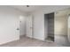 Bright bedroom with a large mirrored closet and a view to an adjacent room at 5726 E Woodridge Dr, Scottsdale, AZ 85254