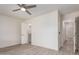 Bright bedroom with wood-look flooring and features a closet and an adjoining bathroom at 5726 E Woodridge Dr, Scottsdale, AZ 85254