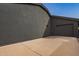 Exterior view of the home showing a side-entry garage and freshly painted stucco at 5726 E Woodridge Dr, Scottsdale, AZ 85254