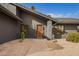 Inviting front entrance with modern door, desert landscape and clear address numbers for easy identification at 5726 E Woodridge Dr, Scottsdale, AZ 85254