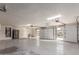 Massive three car garage featuring epoxy flooring, bright lighting, and ample space at 5726 E Woodridge Dr, Scottsdale, AZ 85254