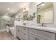 This primary bathroom has double sinks, a walk in shower, and a soaking tub at 5726 E Woodridge Dr, Scottsdale, AZ 85254