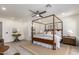 The main bedroom has a four poster bed and a ceiling fan at 5726 E Woodridge Dr, Scottsdale, AZ 85254