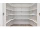 A spacious walk-in pantry features open shelving to maximize storage at 5726 E Woodridge Dr, Scottsdale, AZ 85254