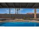 The sparkling pool is lined with custom tile, and has stairs leading to the spa at 5726 E Woodridge Dr, Scottsdale, AZ 85254