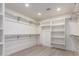 This walk-in closet offers ample storage, racks, and shelving at 5726 E Woodridge Dr, Scottsdale, AZ 85254