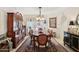 Traditional dining room featuring a chandelier, large rug, and a decorative china cabinet at 5825 N 12Th St # 3, Phoenix, AZ 85014