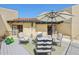 Charming patio with seating, an umbrella, and tile roof, creating a cozy outdoor space at 5825 N 12Th St # 3, Phoenix, AZ 85014