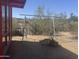 View of the backyard featuring a swing set, mature trees, and an old rustic wood bridge at 6528 N Hillside Dr, Paradise Valley, AZ 85253